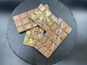 Chocolate bars with splashes of coloures